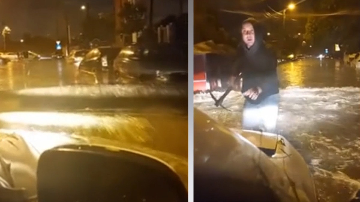 Imagini ȘOCANTE în Capitală! Un bărbat cu un târnăcop în mână încearcă să oprească un șofer care trece cu viteză printr-o zonă inundată