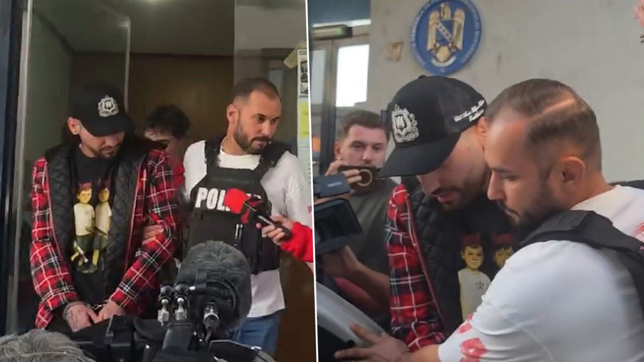 Primele imagini cu trapperul Ian cu momentul reținerii. Încătușat, artistul a fost surprins în timp ce este condus la mașina poliției