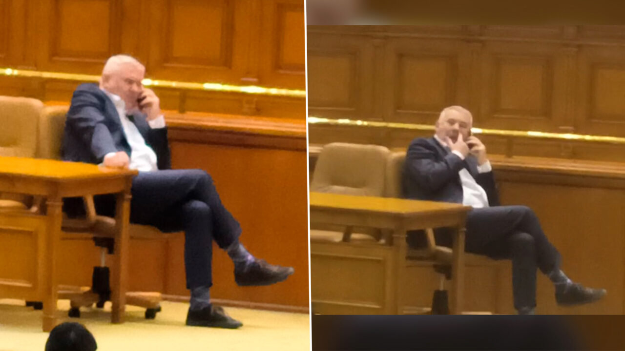Răsturnat pe scaunul chestorilor, deputatul liberal Gigel Ştirbu a vorbit la telefon pe scena plenului şi şi-a expus şosetele vărgate